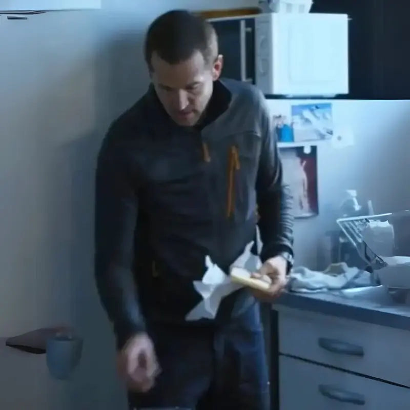 Guillaume Canet black zip-up fleece jacket from Ad Vitam 2025 front view